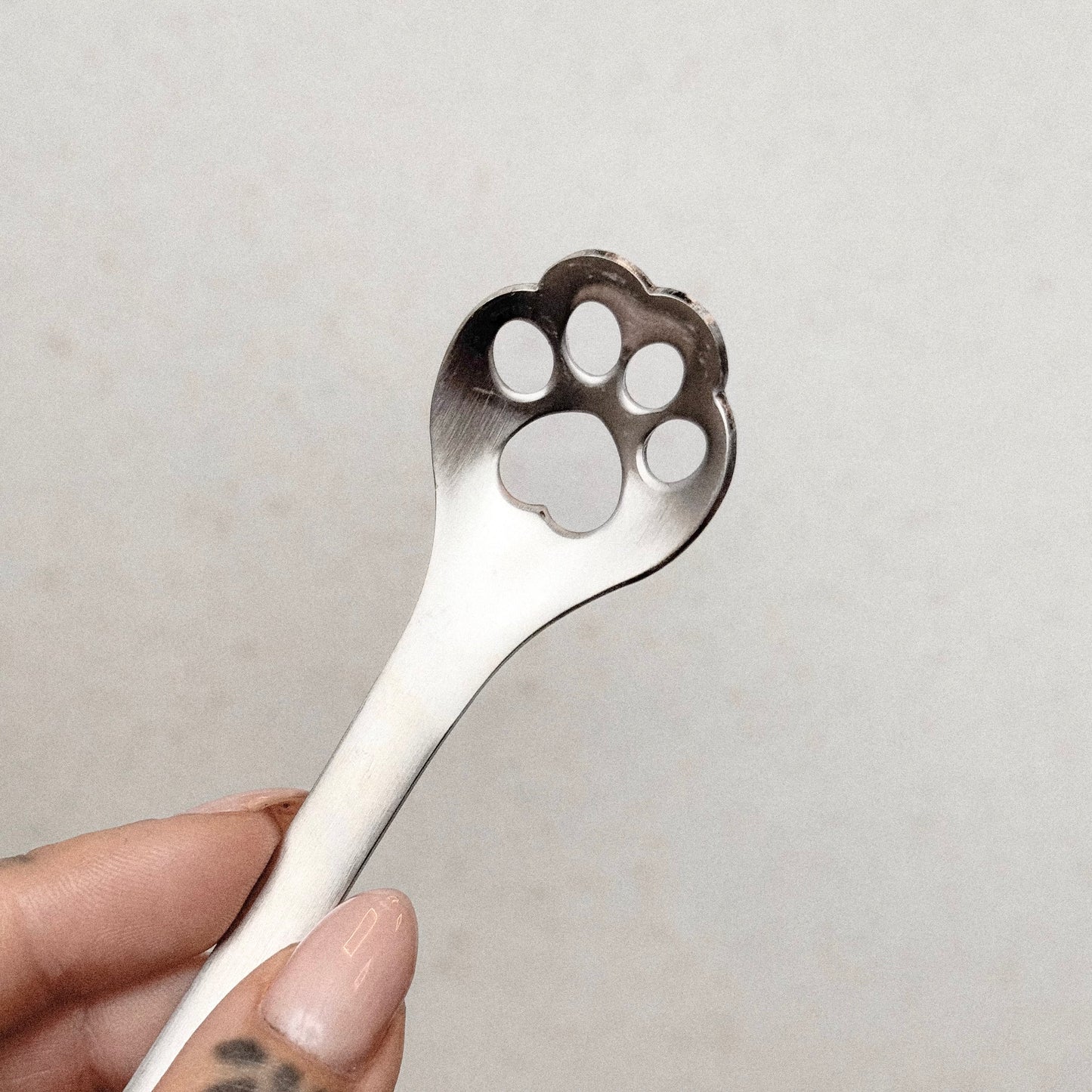 Lepel met pootafdruk