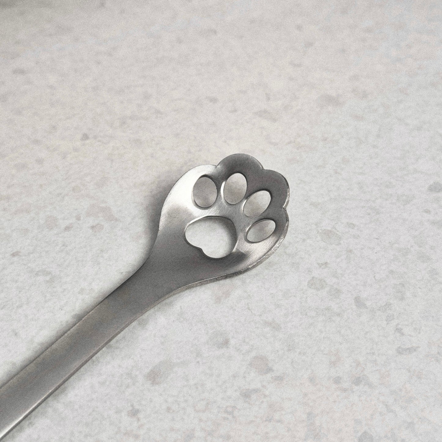 Lepel met pootafdruk