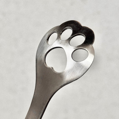 Lepel met pootafdruk